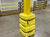 yellow column guard protecting a pillar in industrial environment